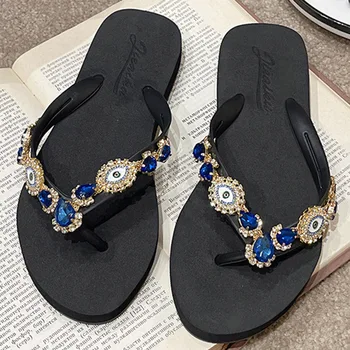 2023 Мода Дамски обувки Лято Нов дизайн Джапанки Женски сини очи Кристална серия Мода Ежедневни плоски плажни плажни сандали.