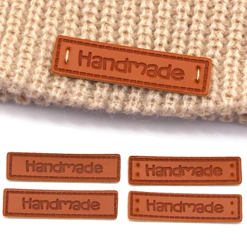 50Pcs 40x11mm Ръчно изработени кожени етикети Правоъгълник PU плетене етикет на шапката Ръчно изработени лого етикети DIY занаяти Шевни материали