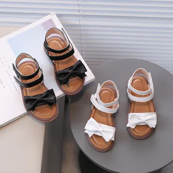 Лято Нови детски сандали за момичета 2023 Нови меки дишащи апартаменти Римски обувки Прости неплъзгащи се лъкове плътен цвят Детски ежедневни обувки